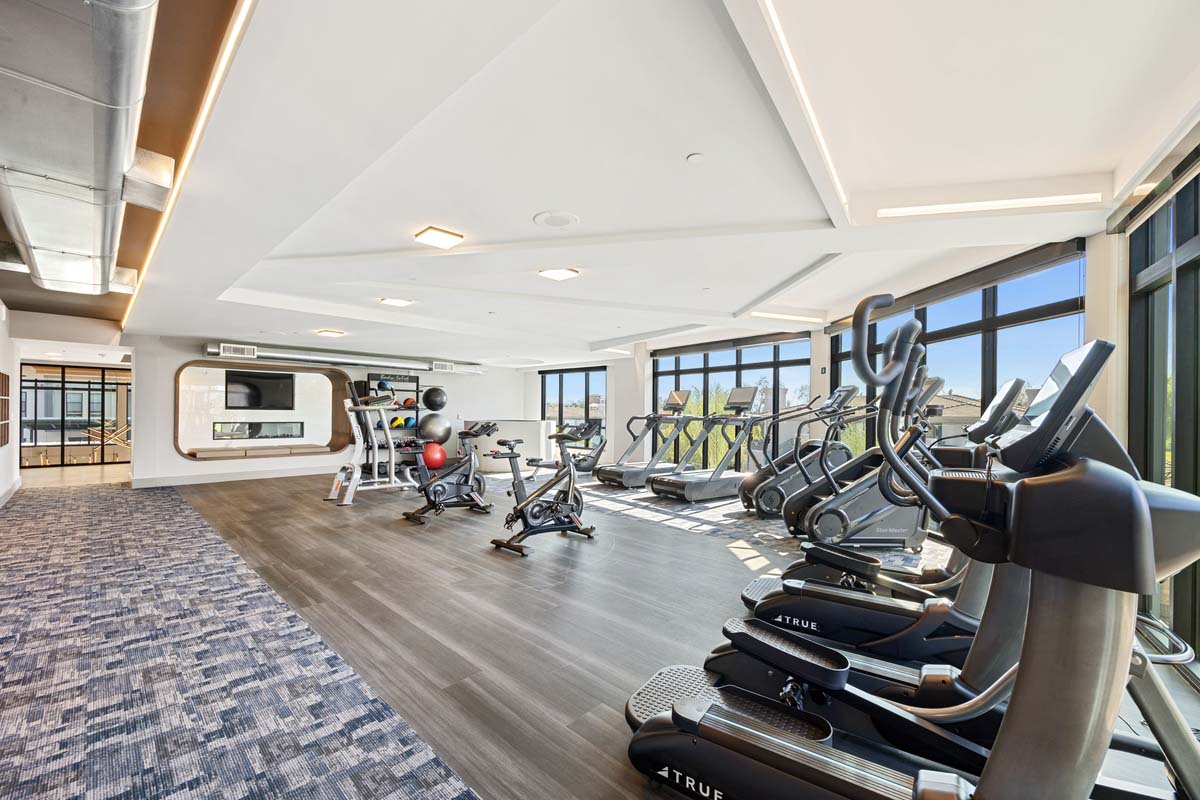 The fitness center at Soltra Kierland apartments for rent in Scottsdale, AZ, featuring treadmills and exercise balls.